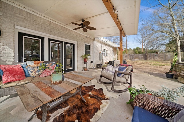 view of patio featuring ceiling fan