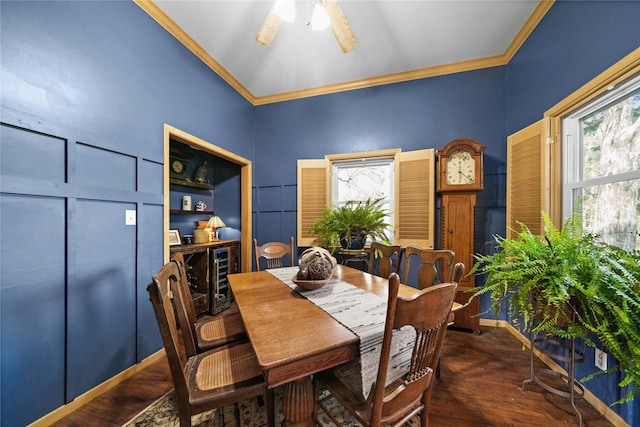 dining room featuring built in features, dark hardwood / wood-style flooring, and ornamental molding