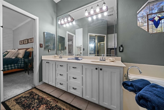 bathroom featuring an enclosed shower, vanity, tile patterned flooring, and crown molding