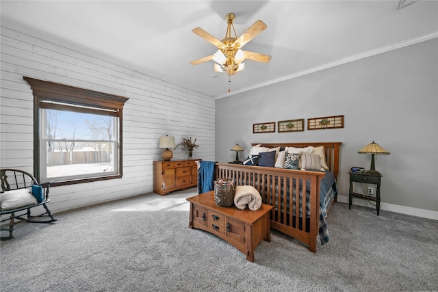 carpeted bedroom with ceiling fan and crown molding