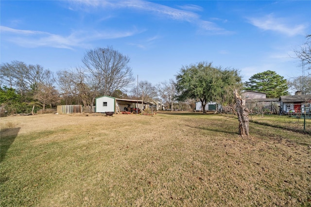 view of yard with a storage unit