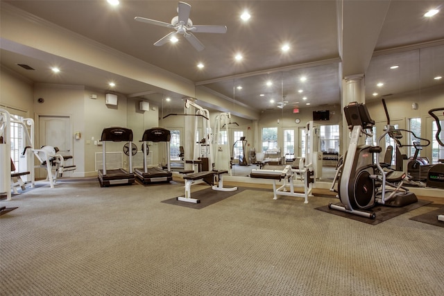 exercise room with carpet, ceiling fan, crown molding, and decorative columns