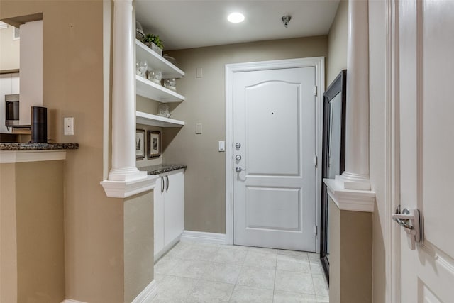 entryway with decorative columns