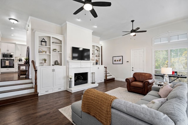 living room featuring ceiling fan, crown molding, and dark hardwood / wood-style floors