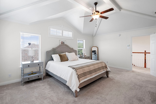 carpeted bedroom featuring ceiling fan, lofted ceiling with beams, and multiple windows