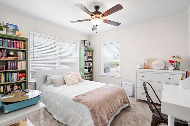 bedroom featuring ceiling fan, light colored carpet, and ornamental molding