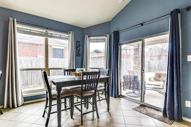 dining area with light tile patterned floors