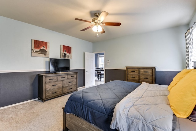 bedroom with ceiling fan and light colored carpet