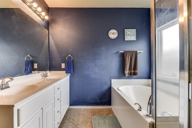 bathroom featuring vanity, a bathtub, and tile patterned floors