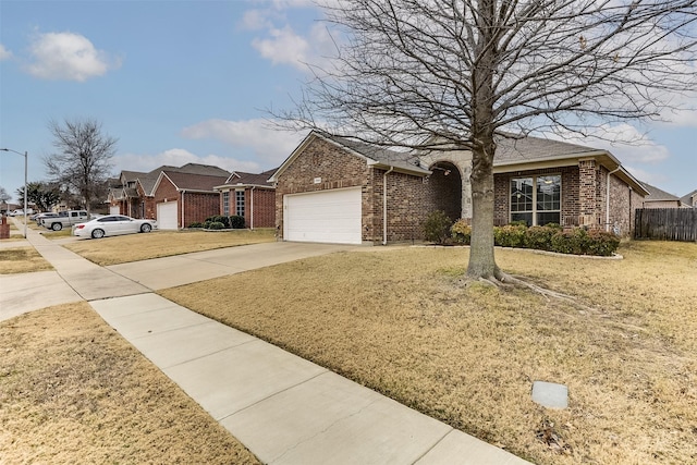 view of front of property with a garage and a front yard