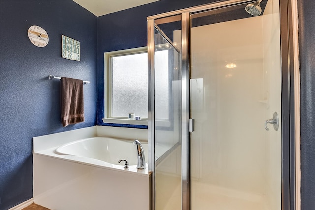 bathroom with separate shower and tub