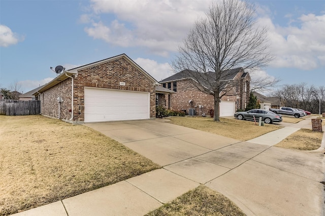 view of front of home with central AC unit and a front yard