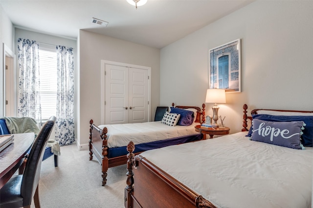 carpeted bedroom with a closet