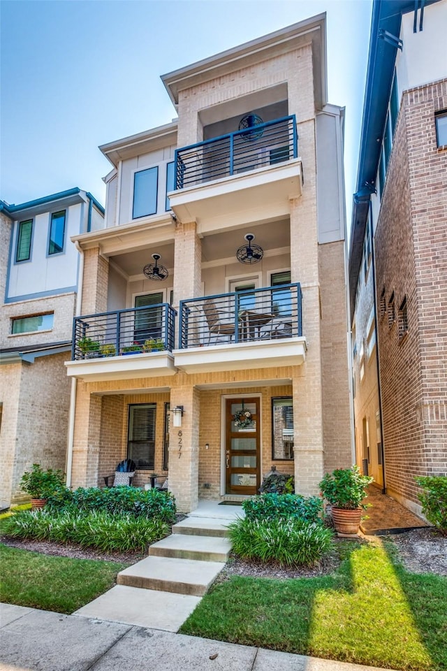 view of front of property with a balcony and a porch