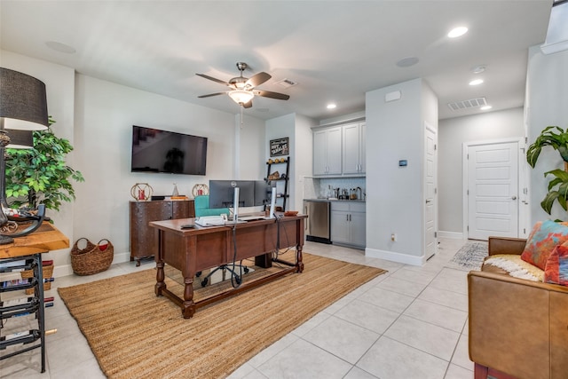 office featuring light tile patterned floors and ceiling fan