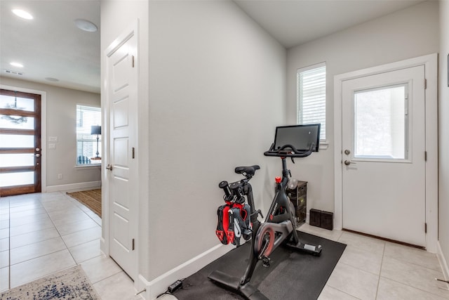 exercise area with light tile patterned flooring