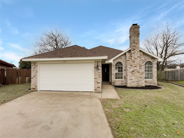 ranch-style house with a garage and a front lawn