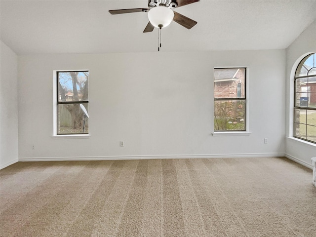 carpeted empty room with ceiling fan