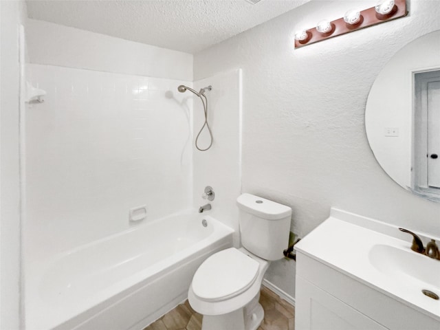 full bathroom with wood-type flooring, toilet, a textured ceiling, vanity, and shower / bathing tub combination