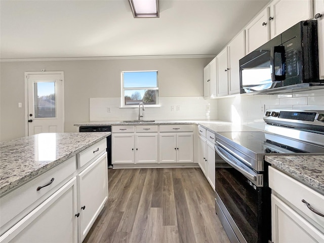 kitchen featuring sink, backsplash, white cabinets, hardwood / wood-style floors, and black appliances