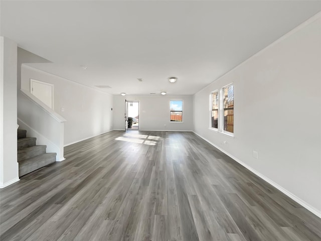 unfurnished living room with dark hardwood / wood-style flooring