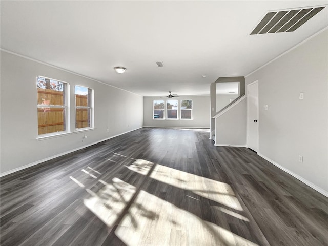 unfurnished living room with dark wood-type flooring, ceiling fan, and ornamental molding