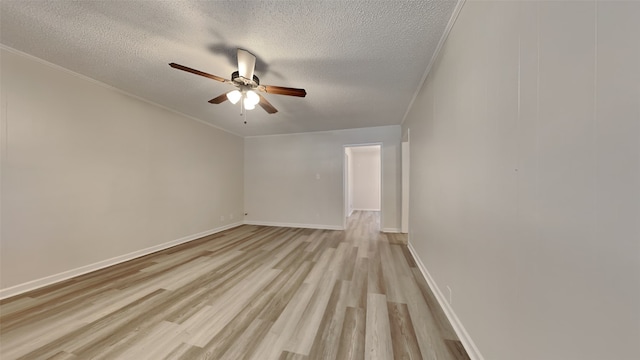 unfurnished room featuring a textured ceiling, ceiling fan, crown molding, and light hardwood / wood-style floors