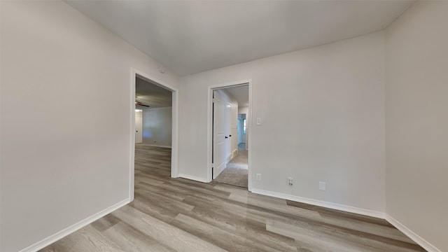 unfurnished room with light wood-type flooring