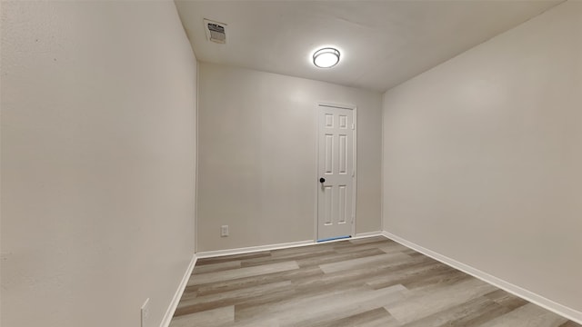 spare room featuring light wood-type flooring