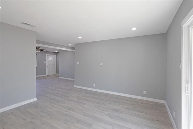 empty room with light wood-type flooring and ceiling fan