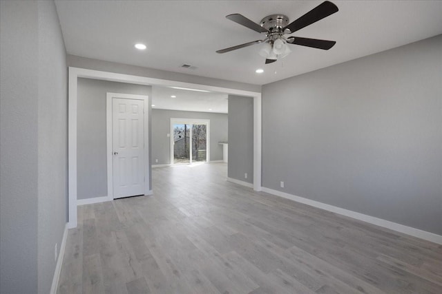 empty room featuring baseboards, visible vents, a ceiling fan, light wood-style floors, and recessed lighting