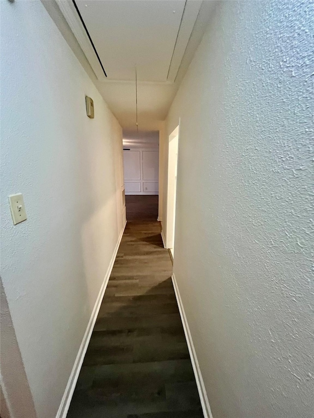 hall with dark hardwood / wood-style flooring