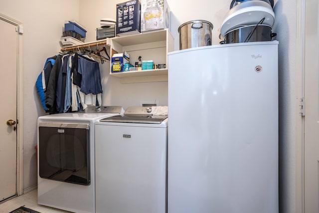 laundry room with washer and dryer