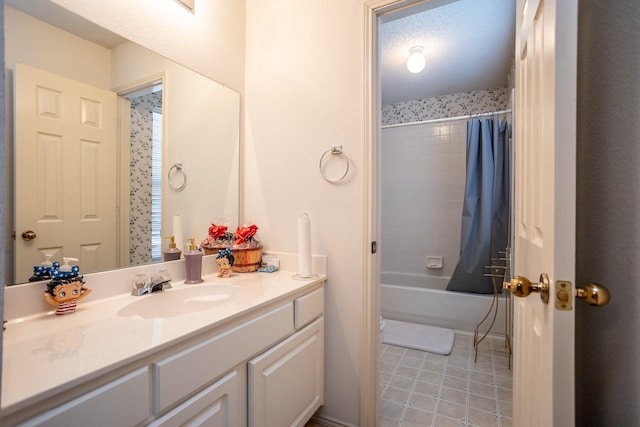 bathroom featuring shower / tub combo, tile patterned floors, vanity, and a textured ceiling