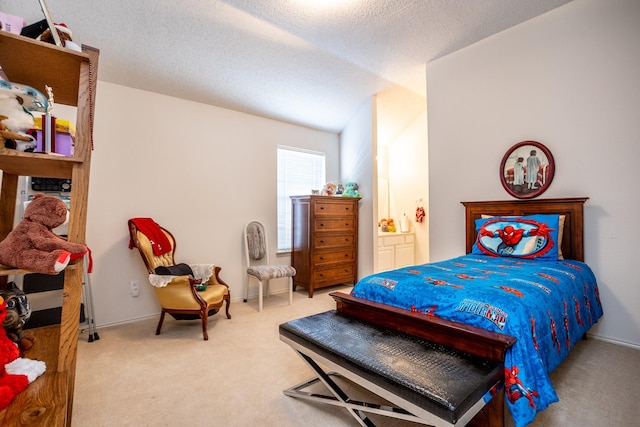 carpeted bedroom featuring a textured ceiling