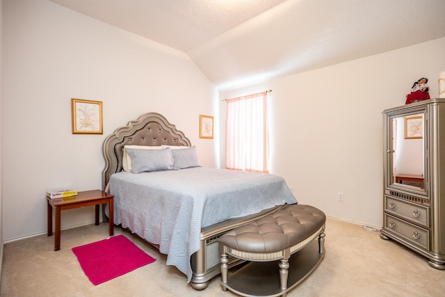 carpeted bedroom featuring vaulted ceiling