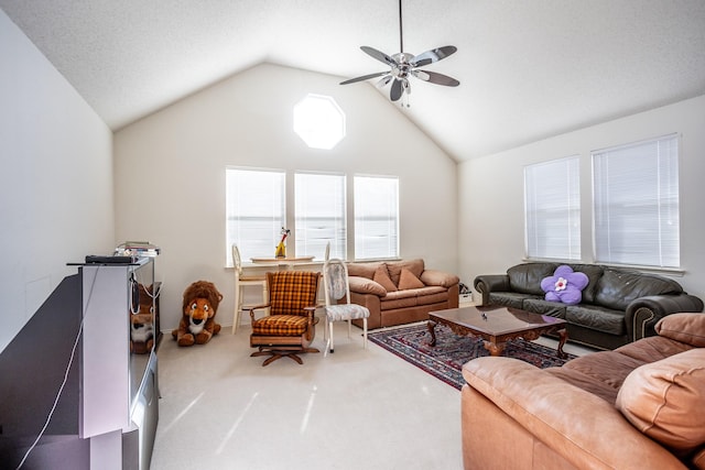 living room with a textured ceiling, ceiling fan, carpet, and lofted ceiling