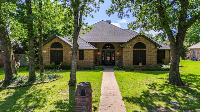 view of front of home with a front yard