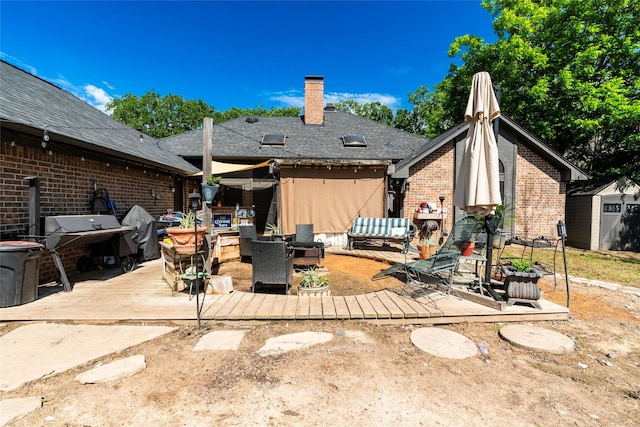 back of property with a patio area and a storage shed