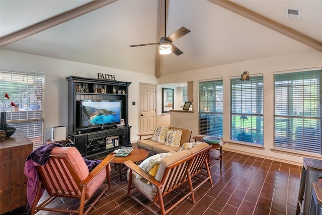 living room with ceiling fan, plenty of natural light, and vaulted ceiling with beams