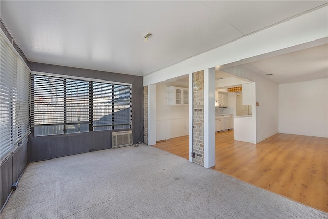 unfurnished room featuring light colored carpet