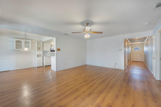 unfurnished living room featuring light wood-type flooring and ceiling fan