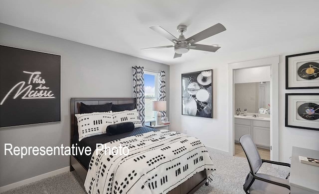 bedroom with ceiling fan, connected bathroom, and light carpet