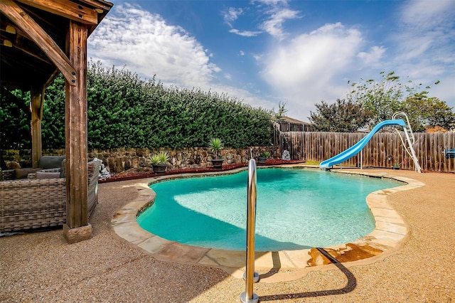 view of pool featuring a fenced in pool, a water slide, and a fenced backyard