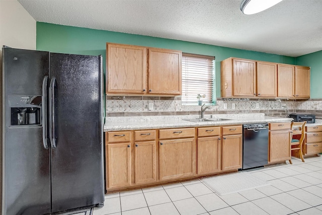 kitchen with a textured ceiling, light tile patterned flooring, sink, and black appliances