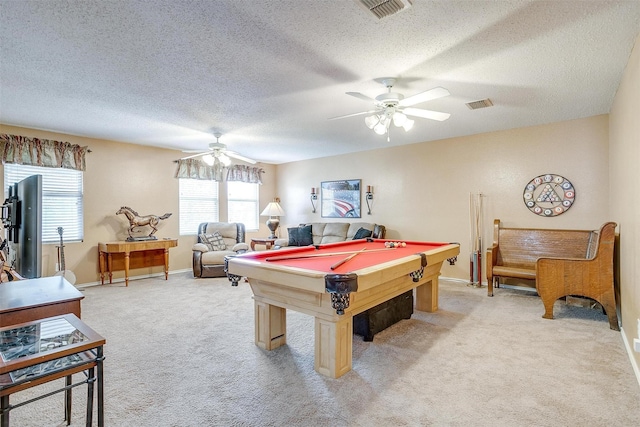 game room featuring light carpet, ceiling fan, a textured ceiling, and billiards