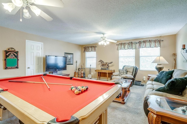 game room featuring a textured ceiling, ceiling fan, light colored carpet, and billiards