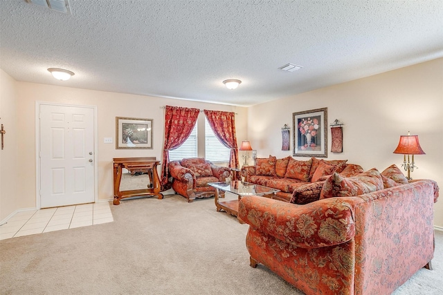 carpeted living room featuring a textured ceiling