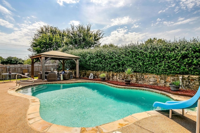 view of pool with an outdoor hangout area, a patio, a gazebo, and a water slide