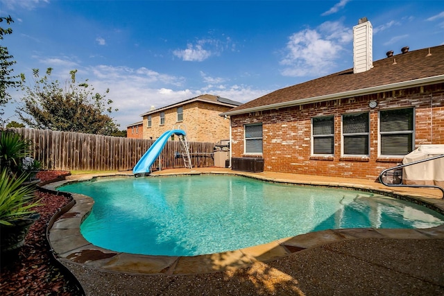 view of swimming pool featuring a water slide